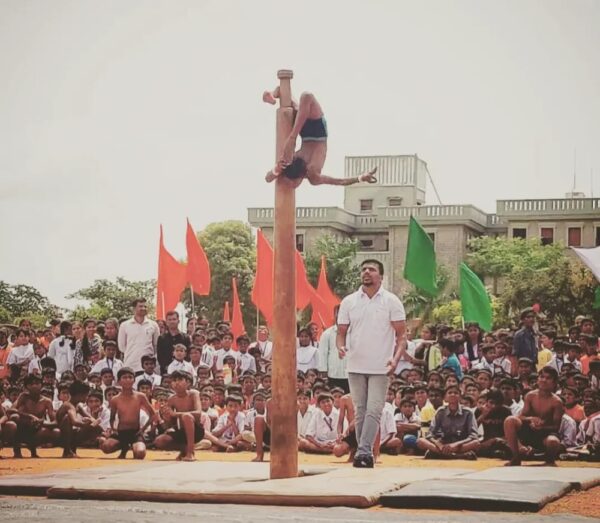 Students performed several postures on the Mallkambh, during the program held at the JSS School, in Suttur, as part of the 75th Indian Independence Day celebrations.