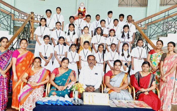 Headmaster and teachers of the JSS Higher Primary School, Suttur, seen with the winners of various competitions held as part of the cluster-level talent hunt competitions.