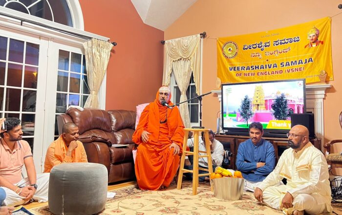 His Holiness Jagadguru Sri Shivarathri Deshikendra Mahaswamiji giving blessings during the Satsang program organized by the Veerashaiva Samaja, New England, USA, held at Boston. Sri Rakesh Alamatti, Dr. Rudramunidevaru, Sri Madhu Akkihebbal and VSNE President Sri Rudresh are seen in the picture.