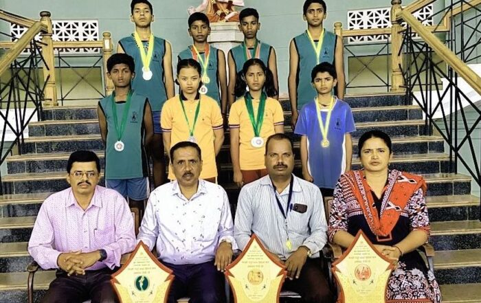 Heads of various departments of the JSS High School, Suttur, and Physical Education instructor, seen with the winners of the taluk-level athletics championships of the school.