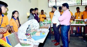 Students seen with the models at the cluster-level educational exhibition held at the JSS High School, Suttur.